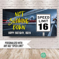 Personalized 16th birthday banner for boys featuring “Not Slowing Down” text, custom name, and a speed limit 16 road sign over a neon city highway background.