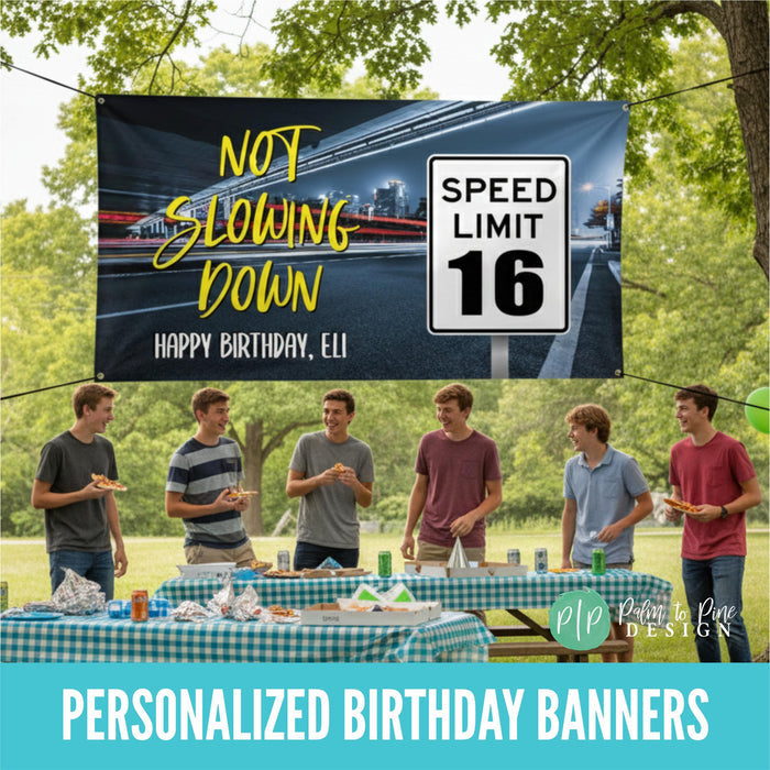 Custom sweet 16 birthday banner for boys with speed limit 16 sign, “Not Slowing Down” wording, personalized name, and neon city highway lights background, hung above a group of boys having an outdoor birthday party eating pizza