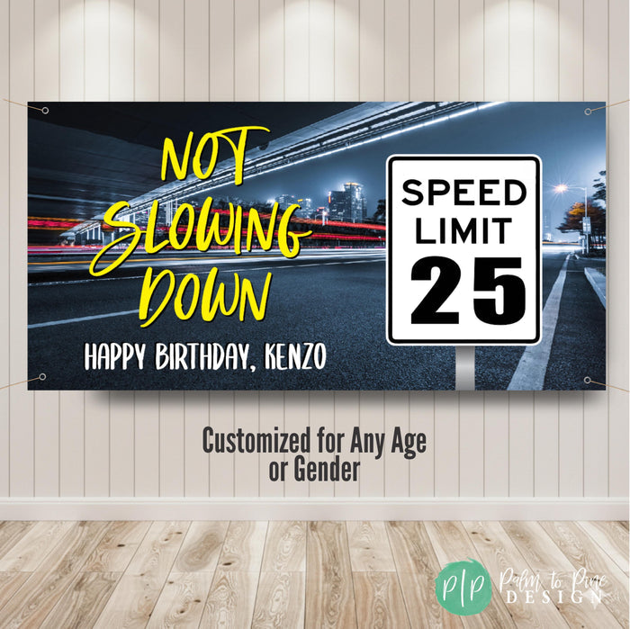 Male birthday speed limit banner with “Not Slowing Down” phrase, custom name, and speed limit 25 sign on a neon city highway backdrop, perfect for milestone birthday celebrations.
