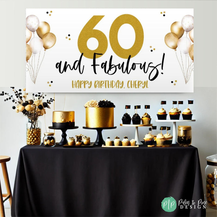 a black and gold themed 60th birthday party including a personalized banner and table topped with a cake and cupcakes