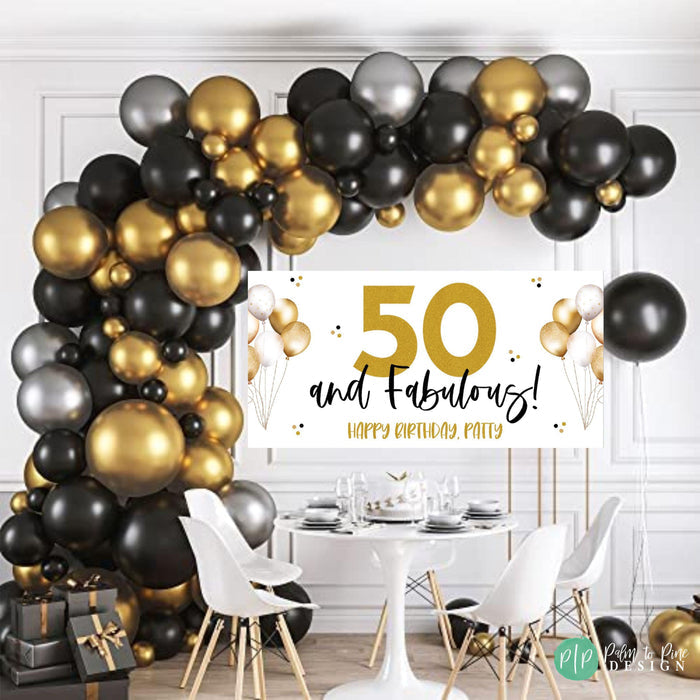 50 and Fabulous Birthday Banner for women in black and gold design with balloon garland