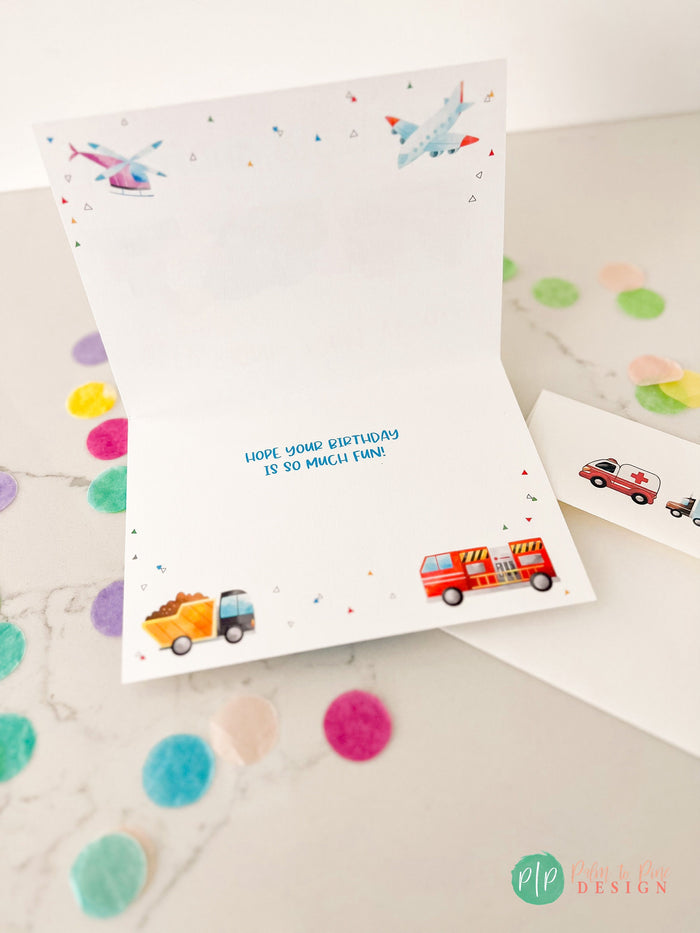 Inside of boys transportation birthday card with firetruck, dump truck, airplane and helicopter