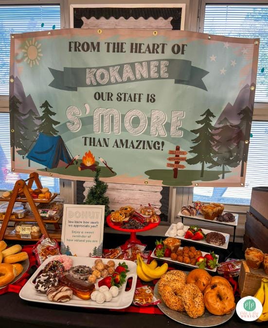 Camping theme teacher appreciation week in staff room with personalized banner, and breakfast pastry spread