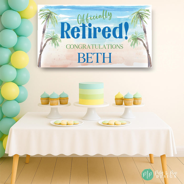 beach themed retirement party with personalized banner and modern dessert table