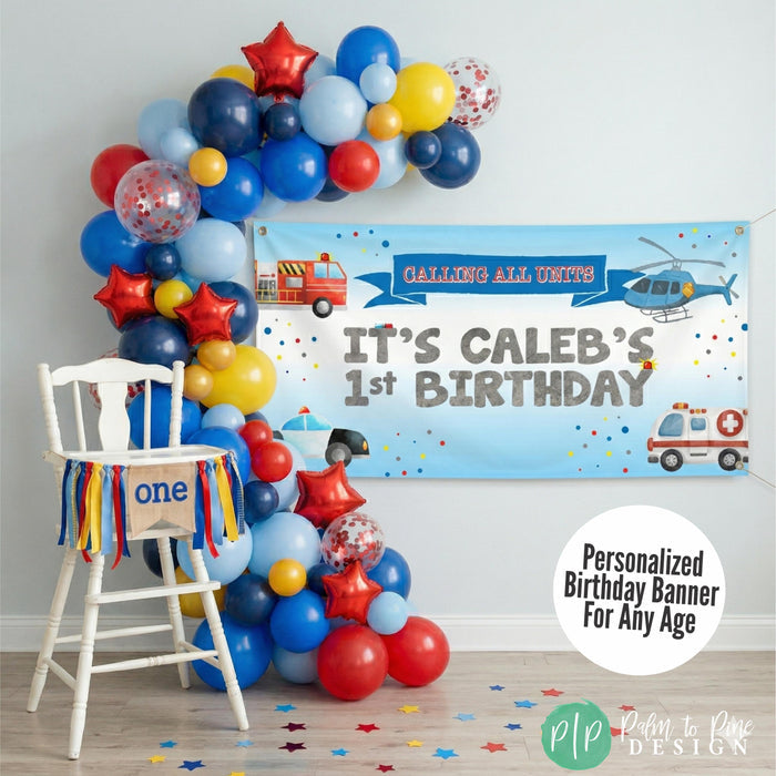 emergency vehicles themed highchair setup for cake smash photos.