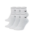 Six pairs of white low-cut athletic socks arranged in two rows, with a small black Nike swoosh logo on the cuff, set against a light gray studio background.