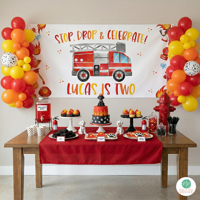 firetruck birthday banner featured at kids firefighter birthday party, with themed dessert table