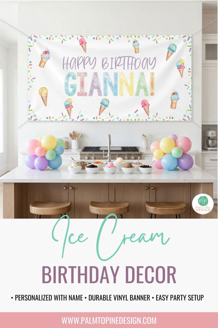 Custom ice cream themed birthday decoration featuring a personalized vinyl banner backdrop. Displayed with grommets above a kitchen counter with pastel balloon clusters and ice cream bowls with toppings.