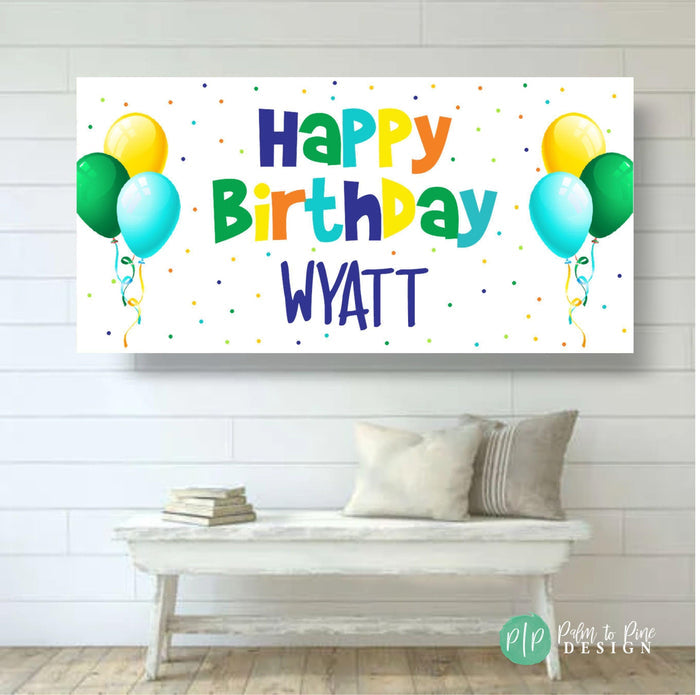 generic happy birthday banner for boys with balloons in blue, green, yellow and orange with polka dots