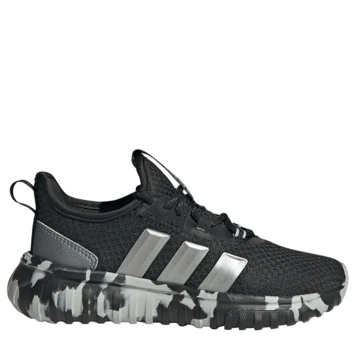 Black athletic shoe with camouflage sole on a light gray background