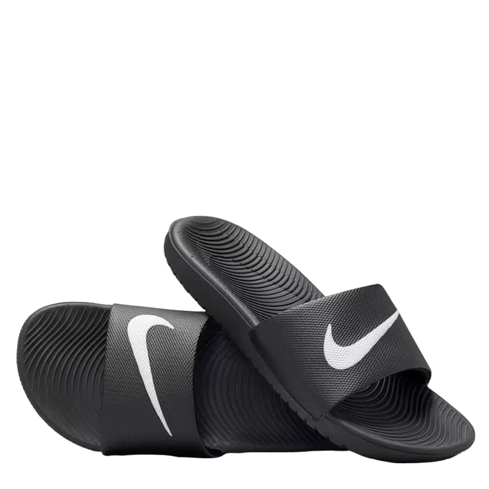 A pair of Nike slide sandals in black with a white Swoosh logo on the straps, displayed against a clean white background.