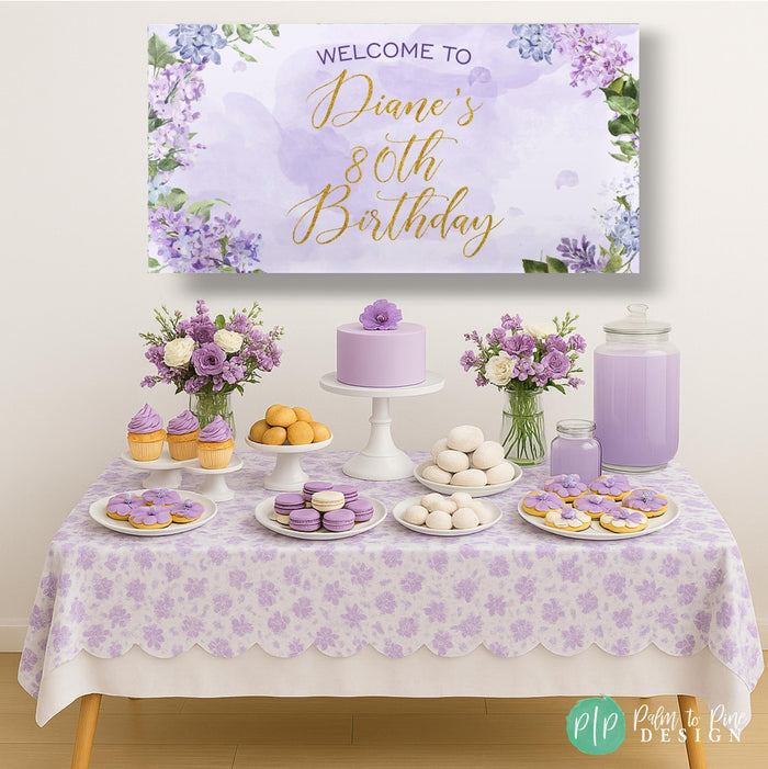 Purple floral birthday banner for women's birthday in front of lavender dessert table