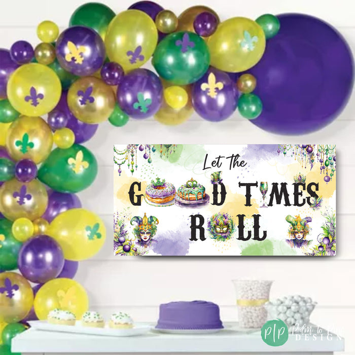 Purple, Gold and Green 'Let the Good Times Roll' Mardi Gras banner with bold letters in traditional colors, featuring beads and festive Mardi Gras icons with a balloon garland.