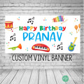 Kids musical birthday banner with rainbow colors on a white background featuring musical notes and instruments.