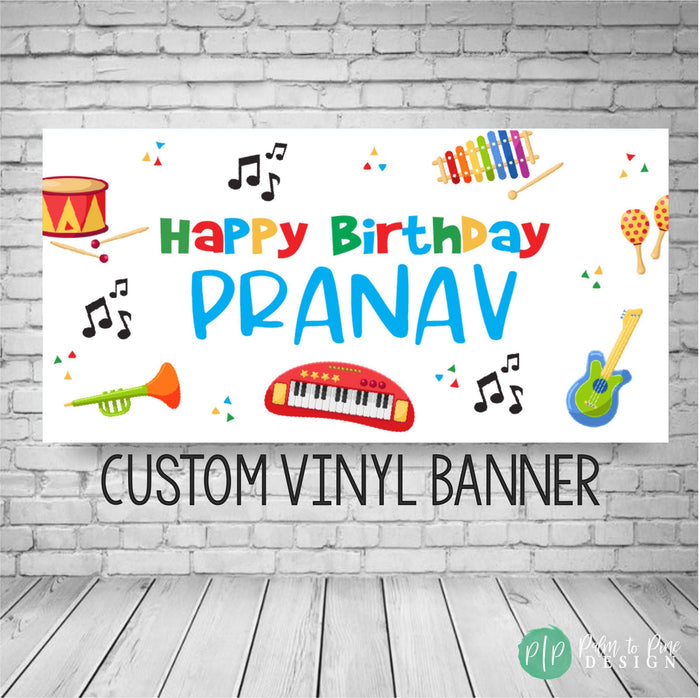 Kids musical birthday banner with rainbow colors on a white background featuring musical notes and instruments.
