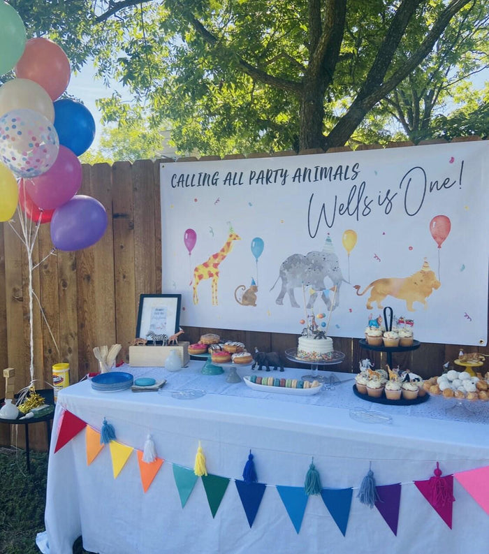 Safari-themed Party Animal banner with custom name, featuring watercolor animals and greenery for a wild birthday celebration