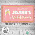 Bridal shower banner in pink and gold with champagne glass cheers