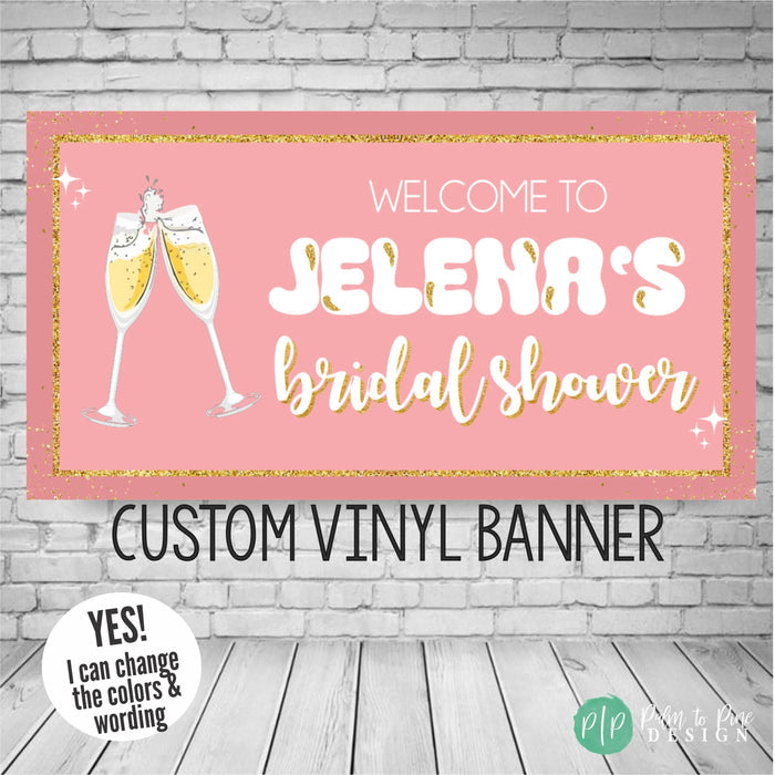 Bridal shower banner in pink and gold with champagne glass cheers