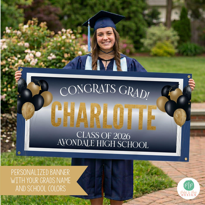 Class of 2026 graduate holding a navy and gold graduation banner, personalized with name, school and school colors