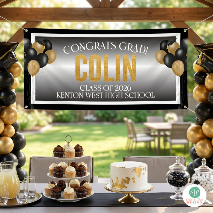outdoor grad party with personalized banner in black and gold color scheme