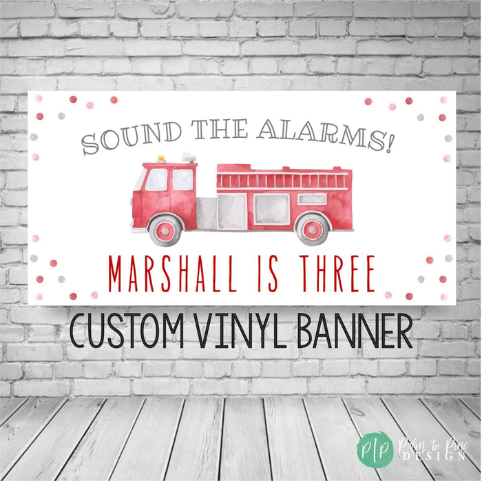 watercolor firetruck birthday banner featuring writing "sound the alarms" personalized with birthday boys name and age. Includes modern watercolor confetti dots