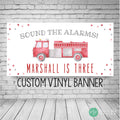 watercolor firetruck birthday banner featuring writing "sound the alarms" personalized with birthday boys name and age. Includes modern watercolor confetti dots