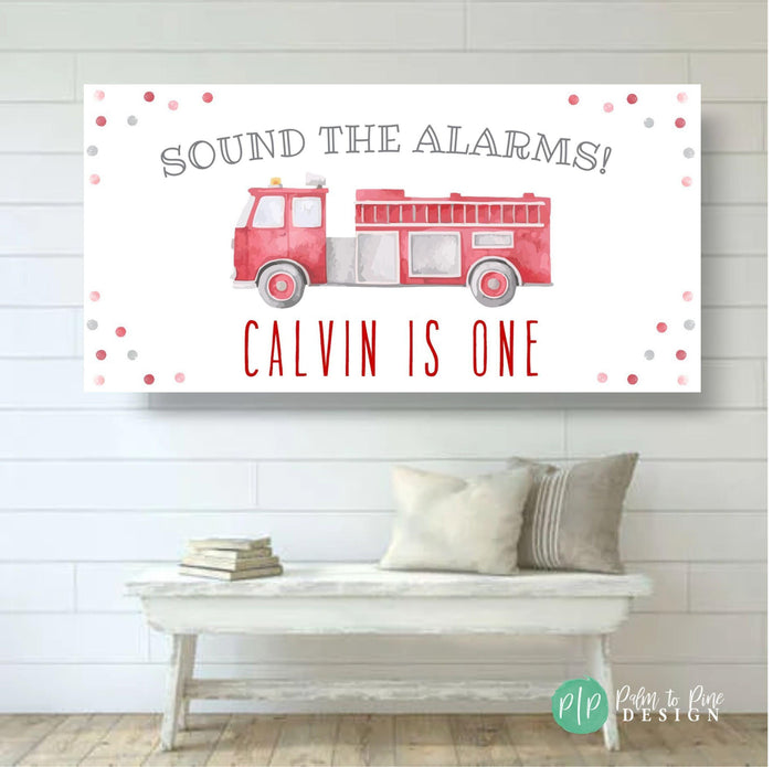Custom firetruck-themed birthday banner with “Sound the Alarms” wording, personalized for a birthday boy. Includes watercolor firetruck and colorful confetti details.