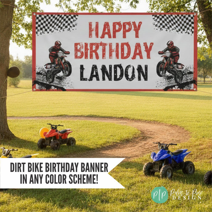 red and blank dirt bike birthday banner hanging outdoors between two large trees