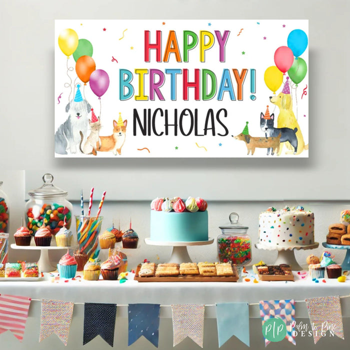 a dog themed birthday party with personalized dog banner, cake, cookies and cupcakes