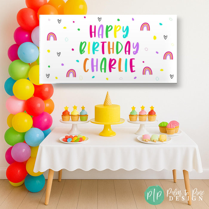 girls bright rainbow birthday theme with personalized banner and balloon garland