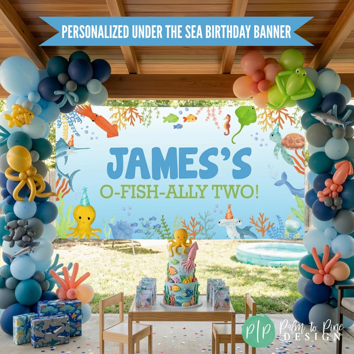 Sea animal birthday party with personalized banner and balloon garland, hung outdoors in backyard gazebo