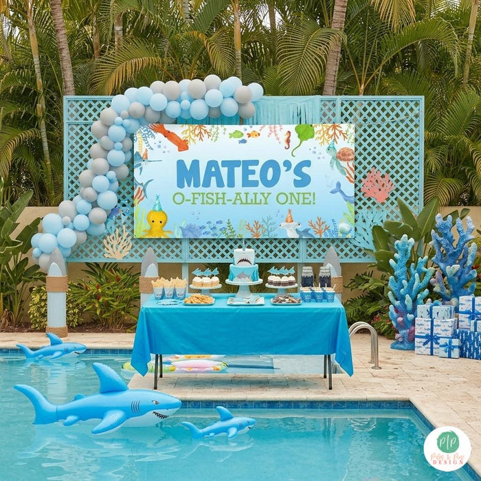 Boys sea life birthday banner at backyard pool party