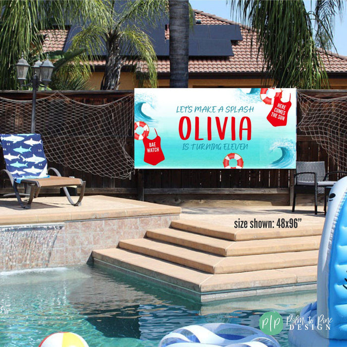 Girls pool party birthday banner hung on fence in front of pool