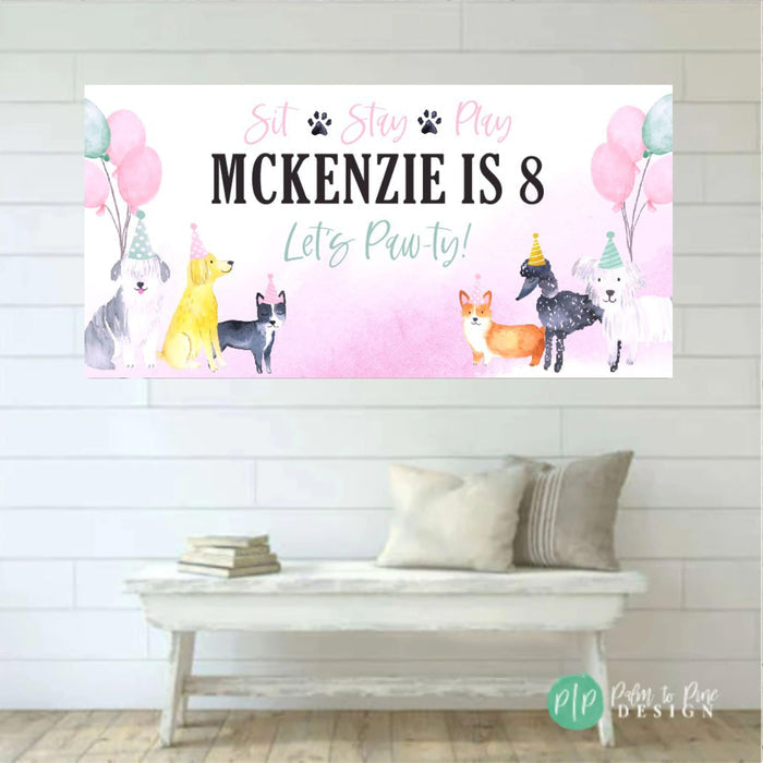 watercolor pink dog birthday banner with playful puppies wearing party hats and surrounded by balloons