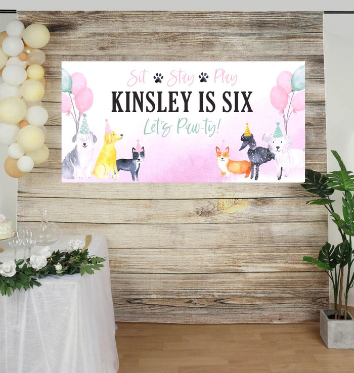 Puppy-themed birthday banner featuring cute dogs in festive hats with bright balloons