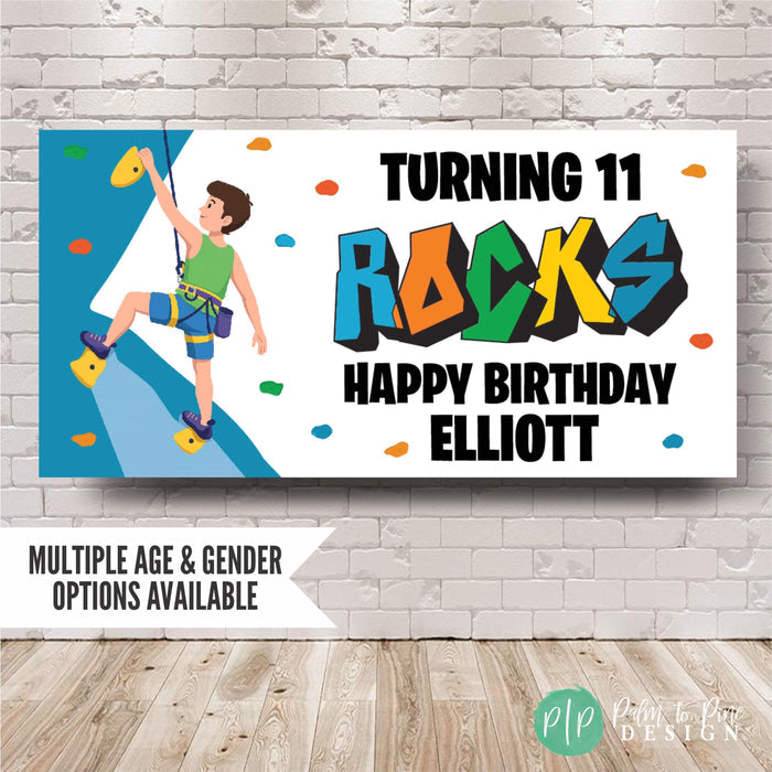 Rock climbing birthday banner on brick wall