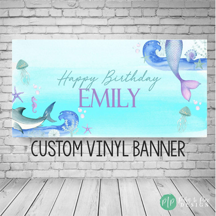 Under the Sea birthday banner for boy and girl with shark tail, mermaid fins, jellyfish, starfish, and ocean animals. Perfect for a joint mermaid and shark party backdrop.