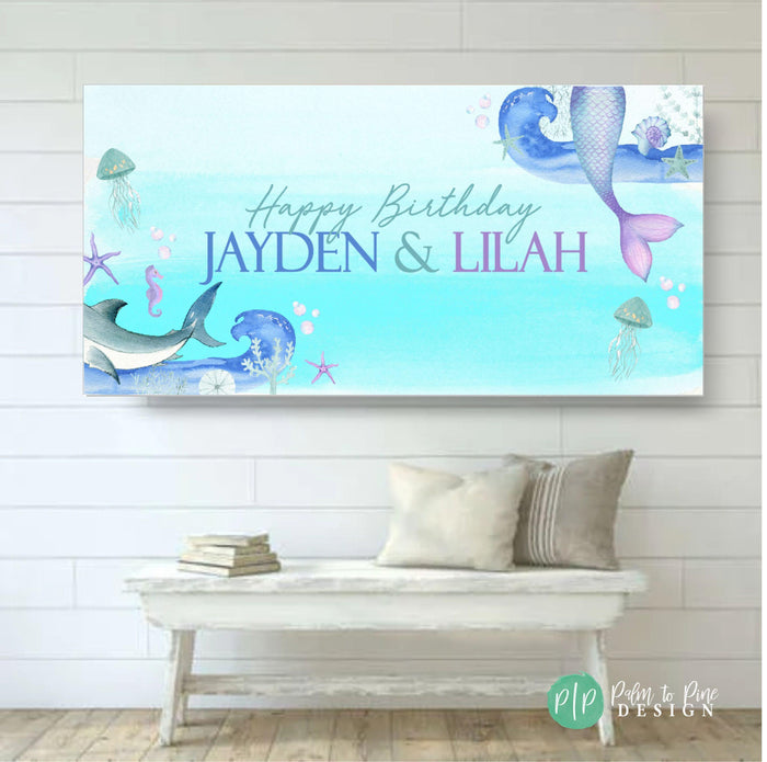 Boy girl Under the Sea birthday banner with mermaid fins, shark tail, and ocean creatures like jellyfish, starfish, and coral. Great for shared parties