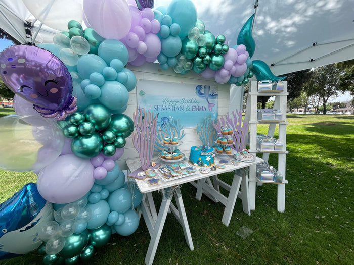 Mermaid and shark party banner for kids birthday with sea animals, bubbles, and underwater theme. Includes jellyfish, shark fin, and starfish illustrations.