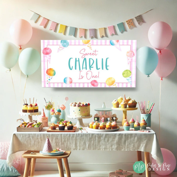Girls Snow cone themed first birthday party in rainbow pastel colors