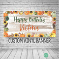 fall birthday banner with pumpkin, fall leaves and sunflower border and rustic wooden background. Happy Birthday and personalized name in modern, fun font