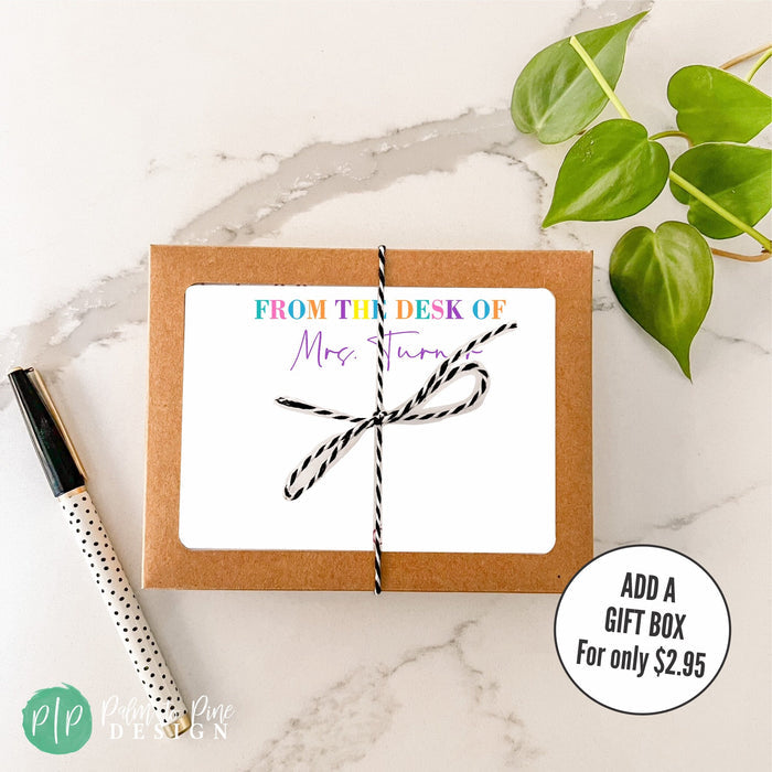 Personalized stationery teacher notecards with rainbow colored text that reads 'FROM THE DESK OF' and personalized teacher name