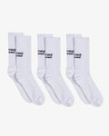 Three pairs of The Athlétique Socks in white, laid flat on a white background. The image highlights the black contrast stitching of the c'est normal and Athlétique logos at mid-calf.