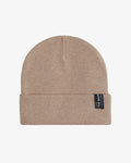 The Beanie in beige laid flat against a white background, featuring a soft fine knit, a fold-over cuff, and the signature black c'est normal label on the right side.