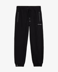 A front view of The Gym Pants in black, laid flat on a white background. The image highlights the elastic waist with a drawstring, hip pockets with premium taped zippers, and the white c'est normal logo on the left thigh.