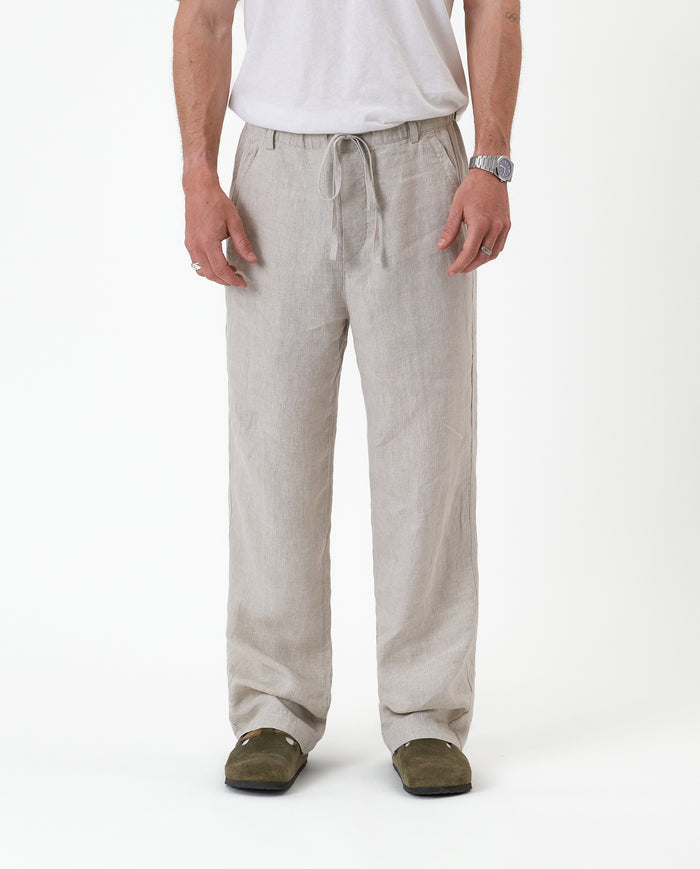 The Holiday Linen Trouser in natural — front view showing the drawstring waist