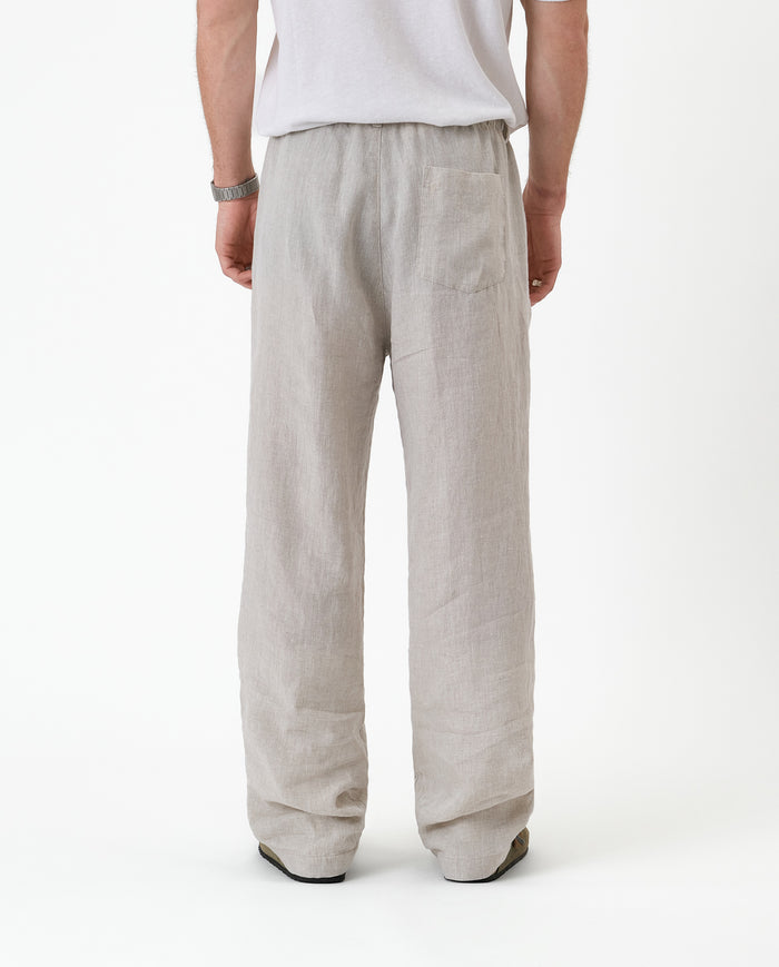 The Holiday Linen Trouser in natural — back view against a white background