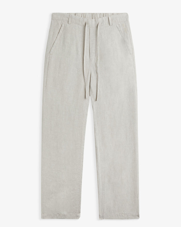 The Holiday Linen Trouser in natural — front view showing the drawstring waist
