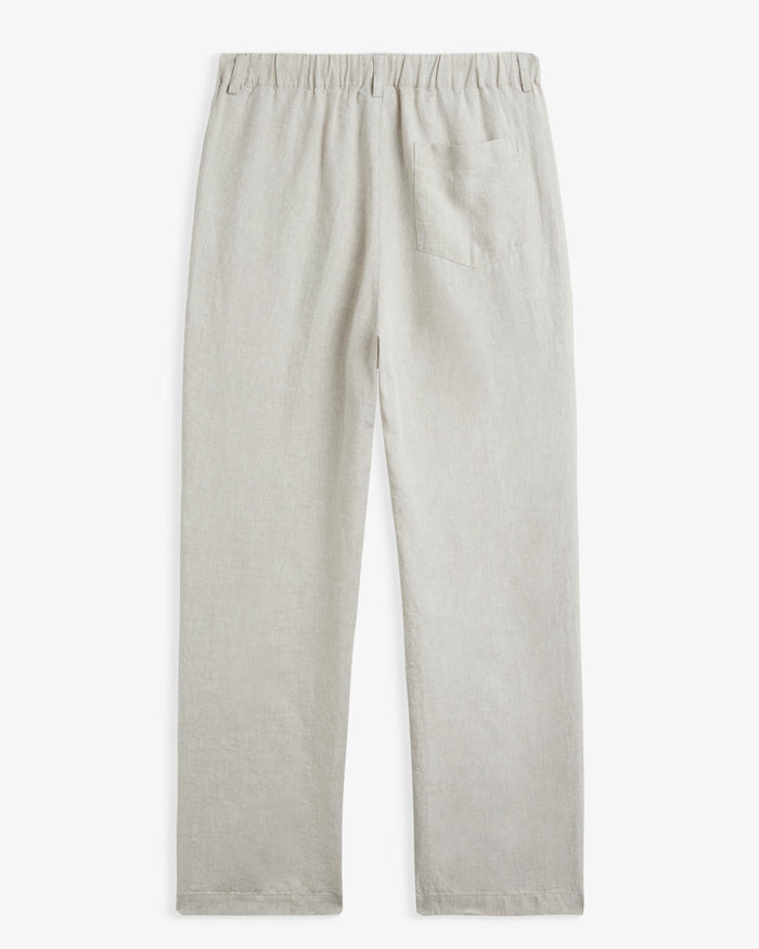 The Holiday Linen Trouser in natural — back view with elasticated waistband and pocket