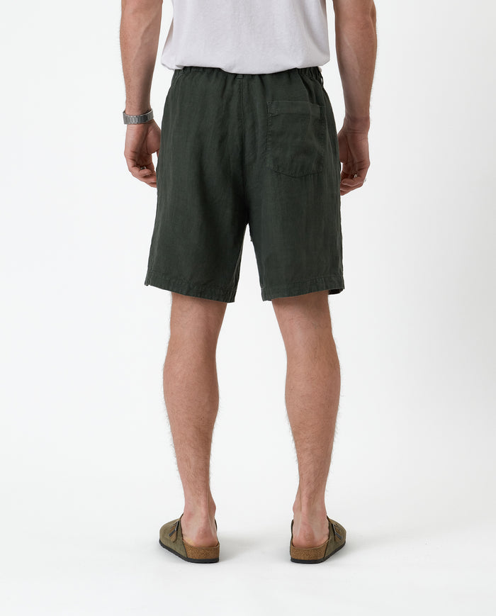 The Holiday Linen Short in dark khaki — back view showing the rear pocket and waistband